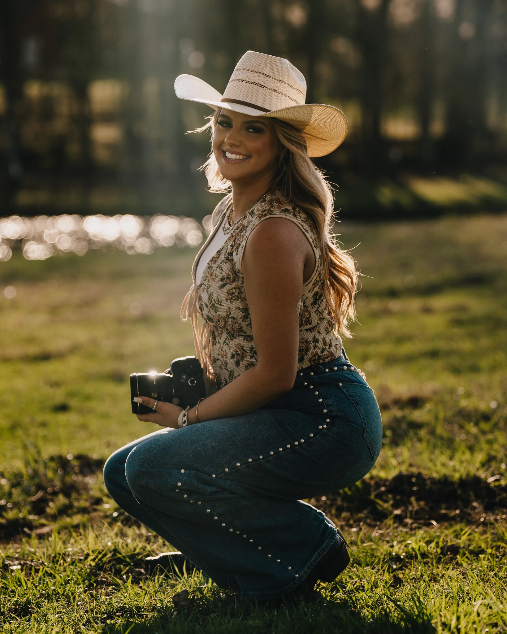Jayda holding her camera in golden light