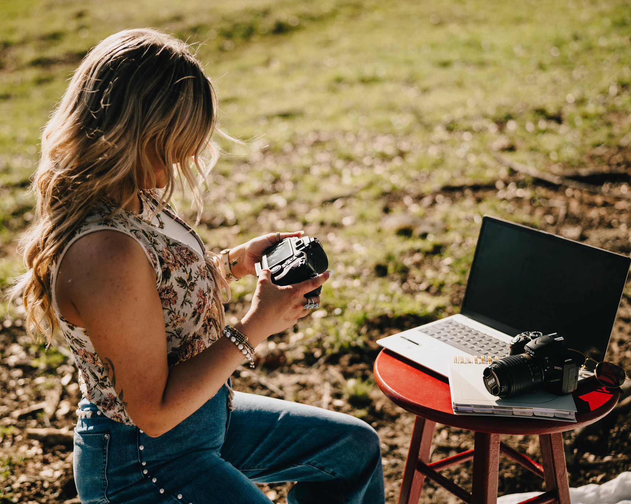 Jayda reviewing photographs on location
